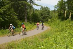 Minnesota's 110 mile Paul Bunyan Trail runs from Brainerd MN to Bemidji offering biking, geocaching, and more.